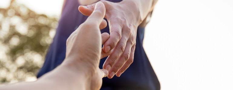 Female hands reaching out for help each other.