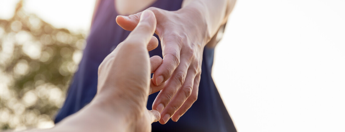 Female hands reaching out for help each other.